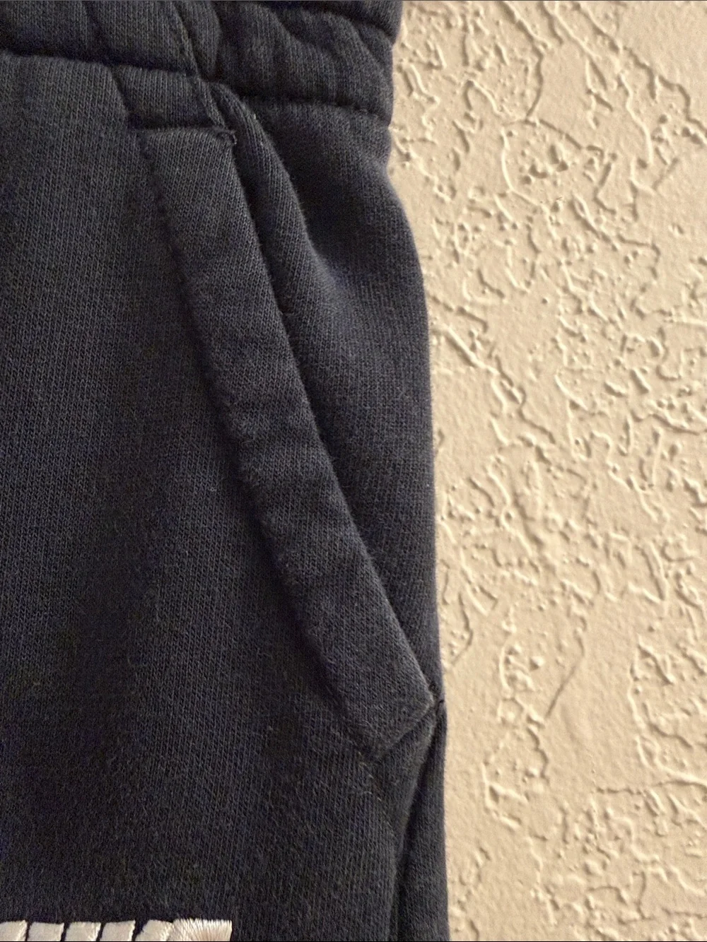 Nike Kids Black Sweatpants with White Swoosh